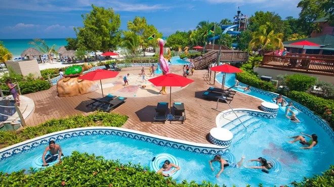 A butler serving guests at a luxury resort, ensuring a stress-free vacation.